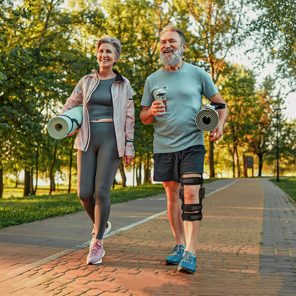 A couple on jogging while wearing knee brace by male - Z1 Knee Brace